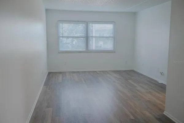 a kitchen with a refrigerator and cabinets