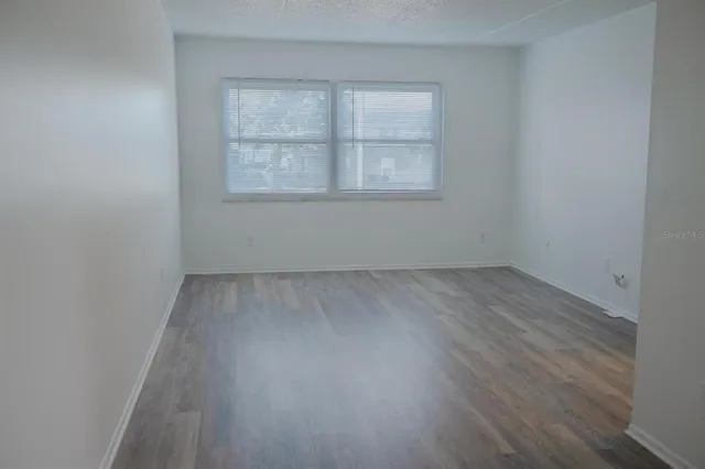 a kitchen with a refrigerator and cabinets