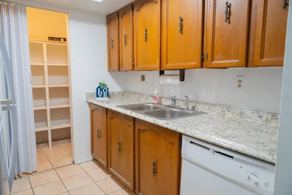 a stove top oven sitting inside of a kitchen