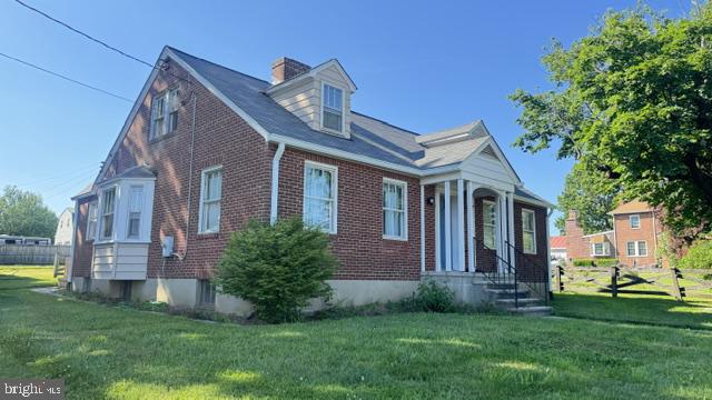 816 North Houcksville Road Hampstead, MD 21074 - Photo 3 of 23 Charming brick home with lush greenery.