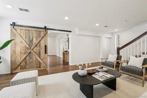 a living room with furniture and a table