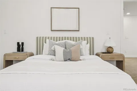 a large white bed in a white room