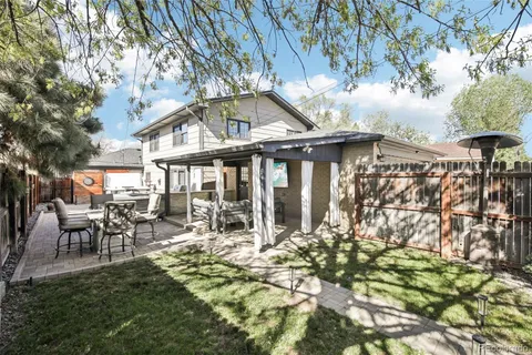 a view of a backyard with a tree