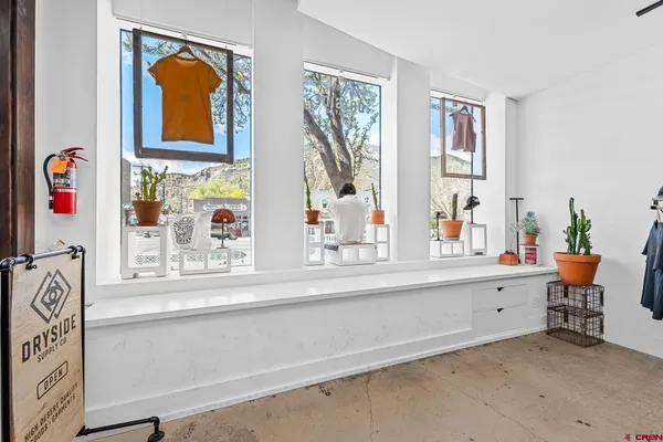 a living room with furniture and window