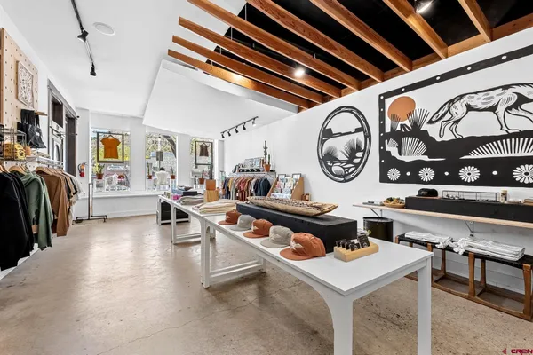 a living room with lots of furniture and a clock