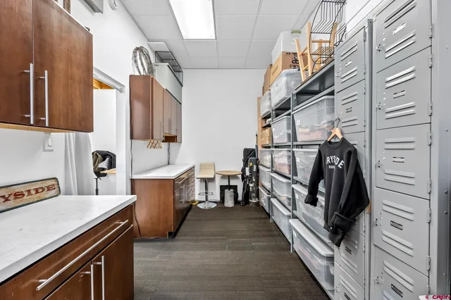 a view of a kitchen with utility room and wooden floor