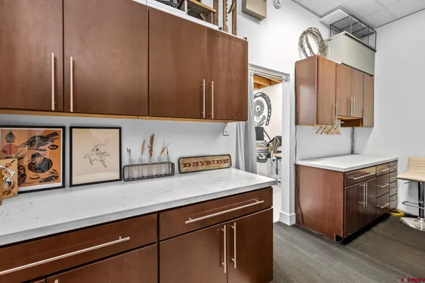 a kitchen with stainless steel appliances a sink a stove and a microwave