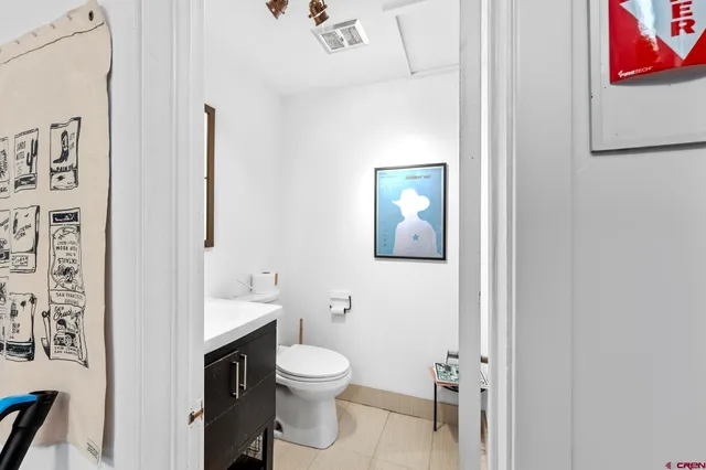 a bathroom with a toilet and a sink