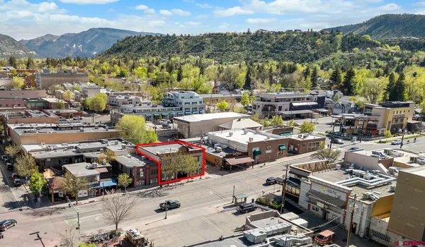 a picture of city view with lots of car parked