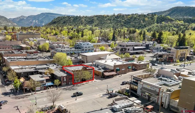 a picture of city view with lots of car parked