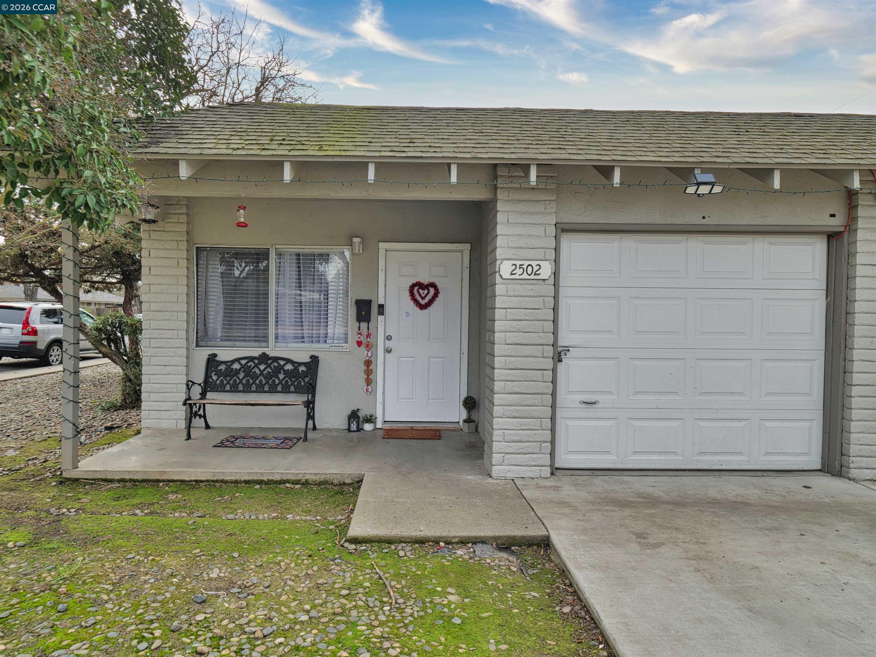 2500 Haddon Avenue Modesto, CA 95354 - Photo 14 of 37 a front view of a house with a yard