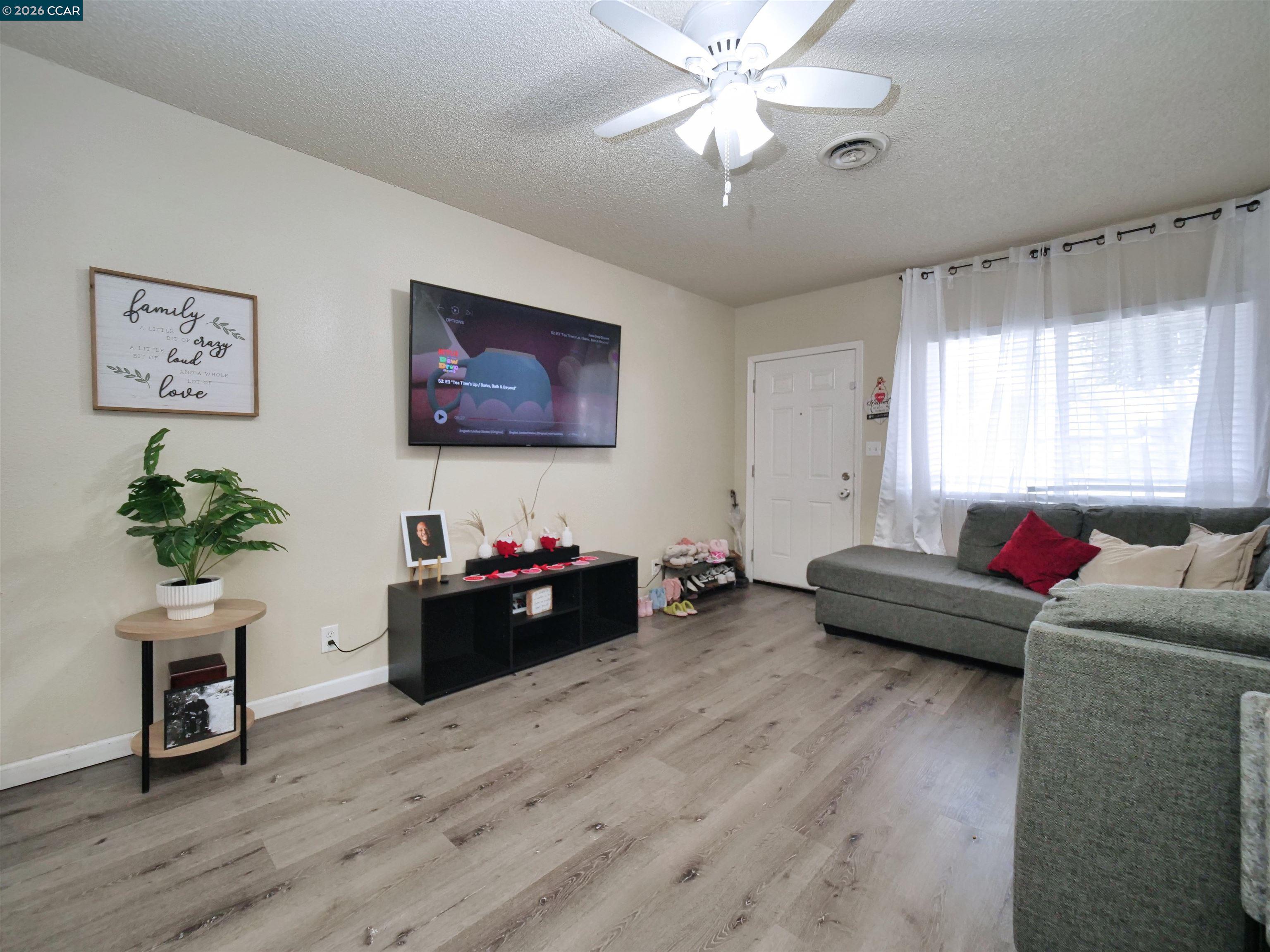 2500 Haddon Avenue Modesto, CA 95354 - Photo 17 of 37 a living room with furniture and a flat screen tv