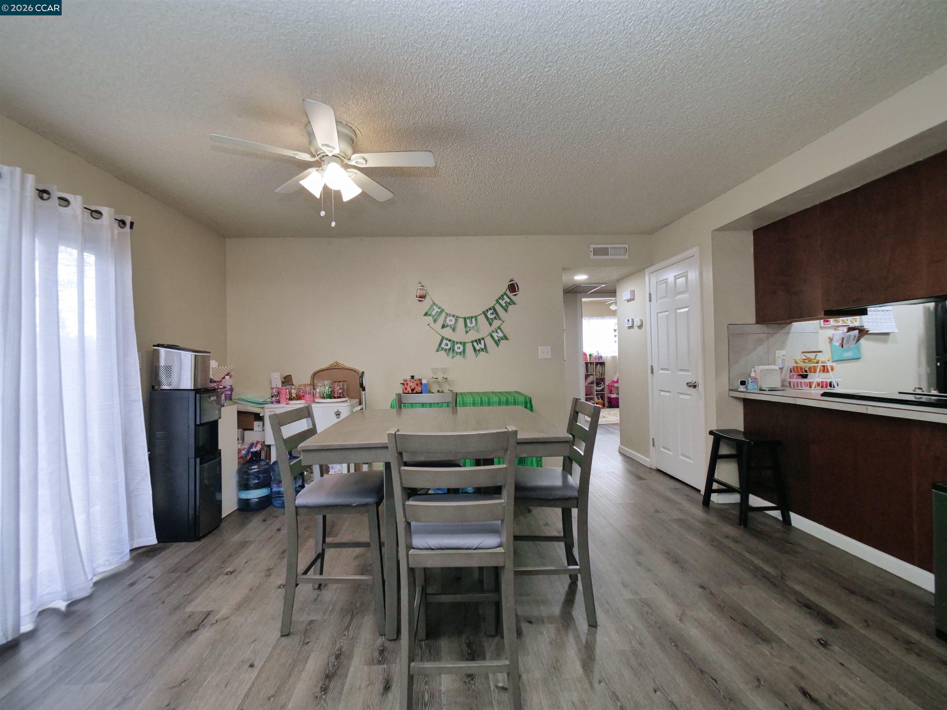 2500 Haddon Avenue Modesto, CA 95354 - Photo 18 of 35 a view of a dining room with furniture and wooden floor