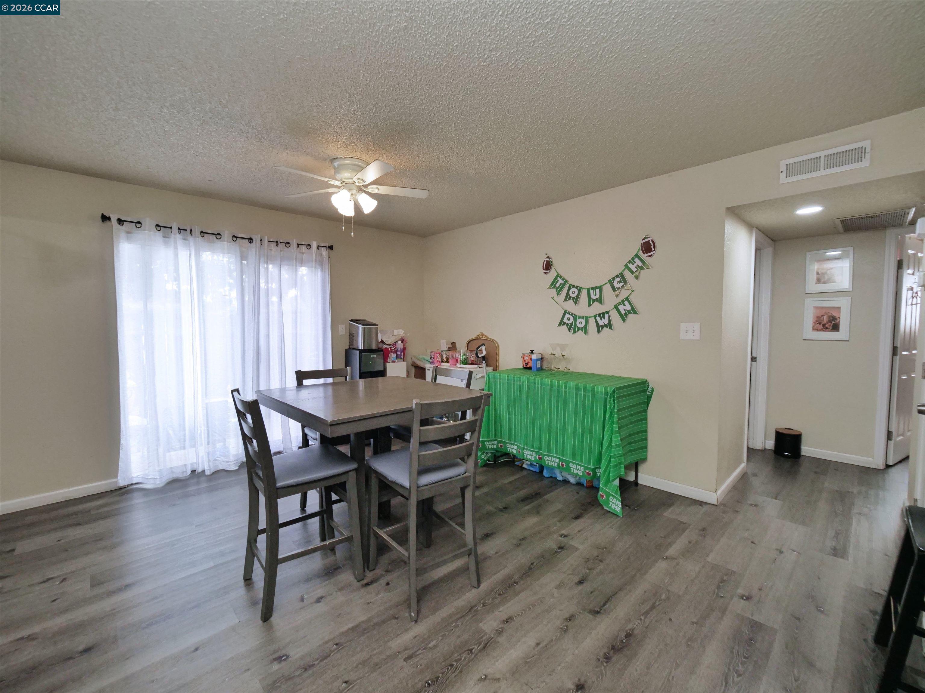 2500 Haddon Avenue Modesto, CA 95354 - Photo 19 of 35 a view of a dining room with furniture window and wooden floor