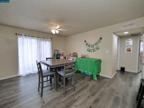 a view of a dining room with furniture window and wooden floor
