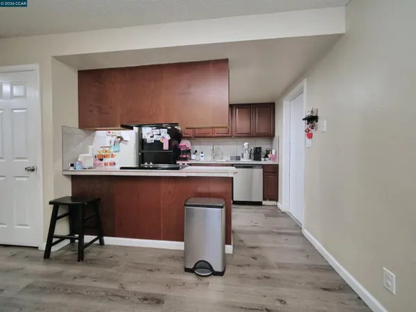 a kitchen with a sink cabinets and window