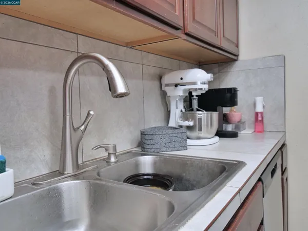 a kitchen with a sink and a stove