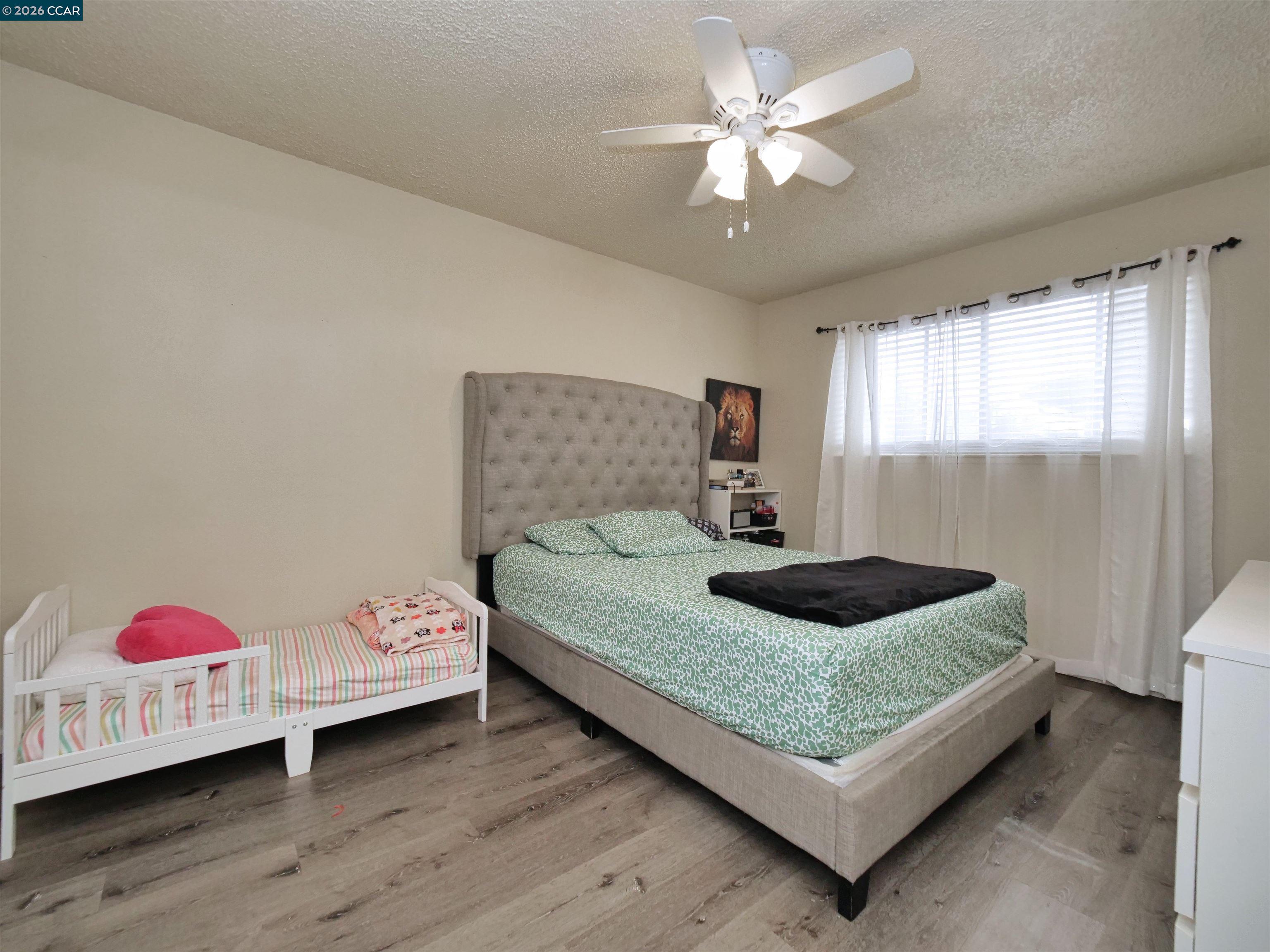 2500 Haddon Avenue Modesto, CA 95354 - Photo 31 of 37 a bedroom with a bed and window