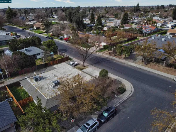 an aerial view of a house with a yard lake view
