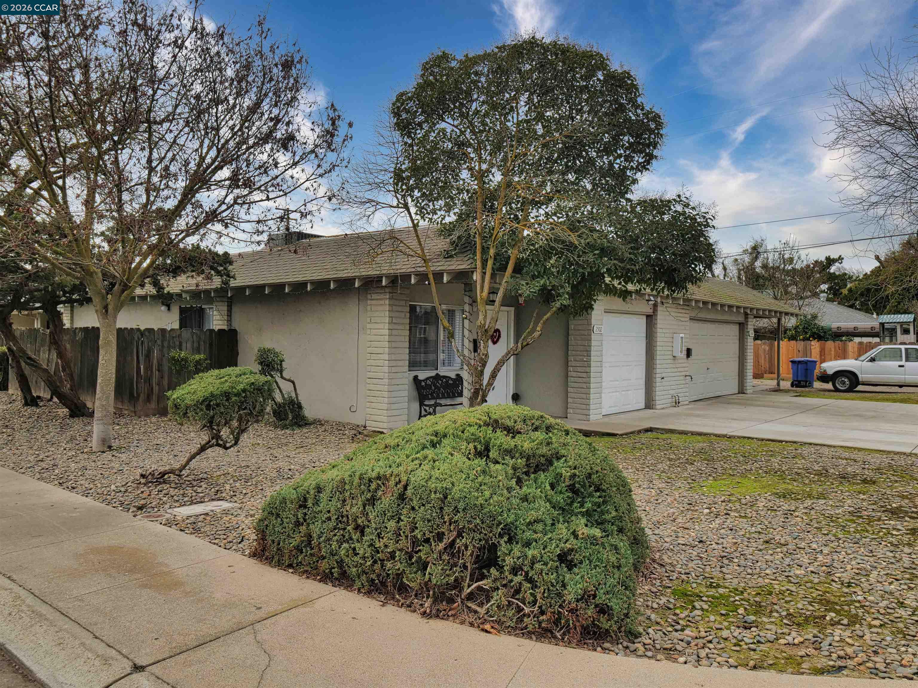2500 Haddon Avenue Modesto, CA 95354 - Photo 5 of 37 a front view of a house with garden