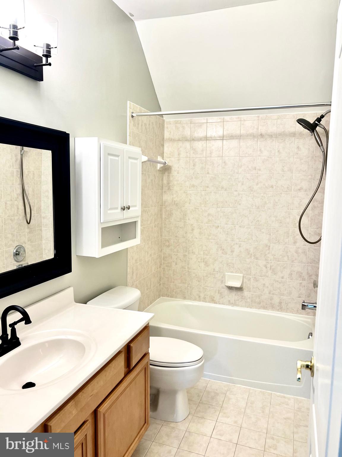 14468 Village High Street, Unit 148 Gainesville, VA 20155 - Photo 12 of 14 a bathroom with a sink toilet and shower
