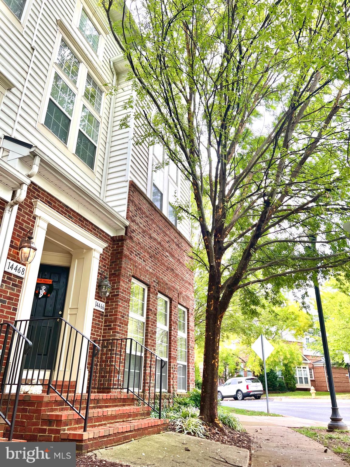 14468 Village High Street, Unit 148 Gainesville, VA 20155 - Photo 2 of 14 a view of a building with a tree