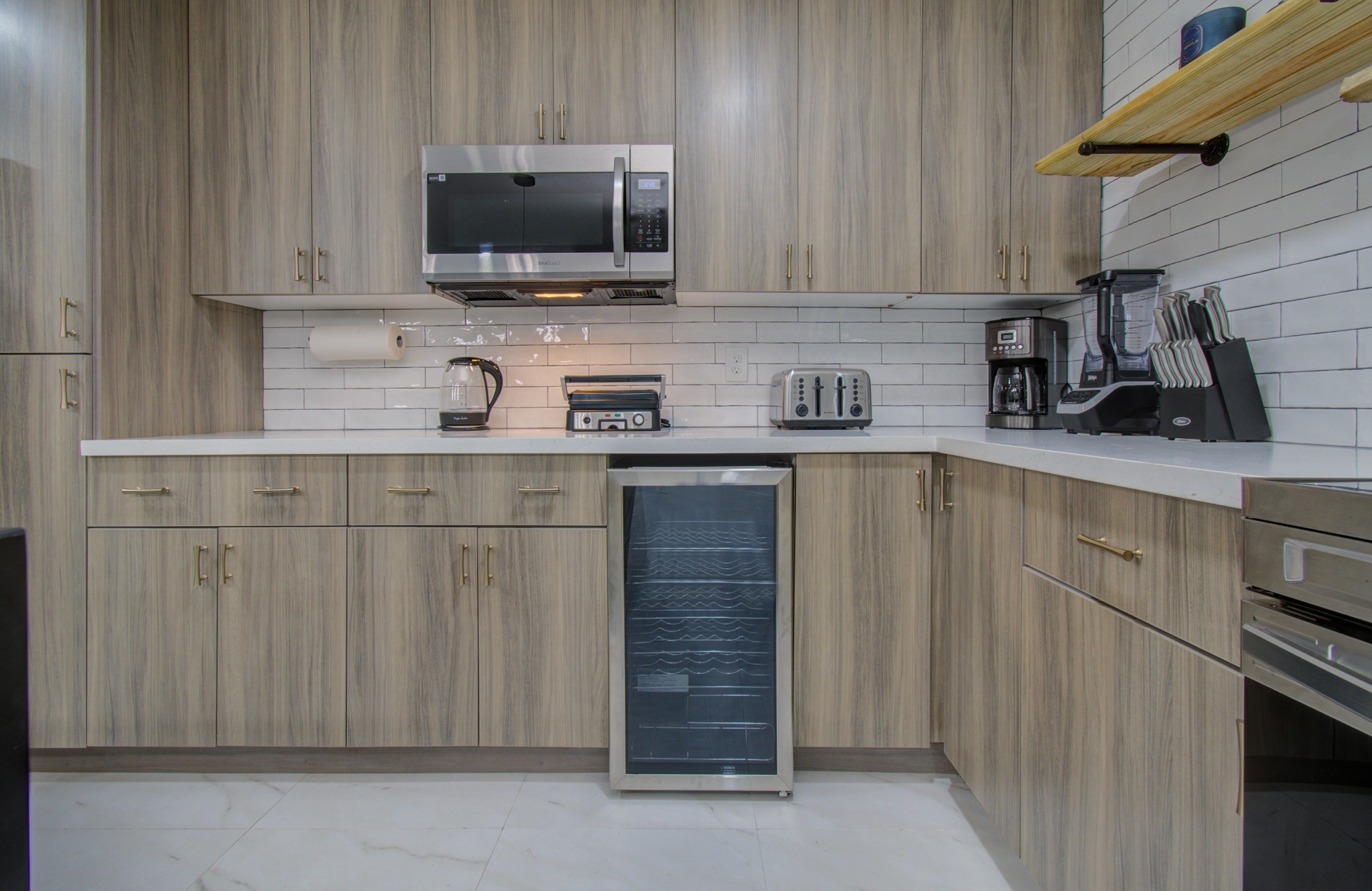 5539 Edith Street Houston, TX 77081 - Photo 13 of 50 a kitchen with stainless steel appliances granite countertop a stove a sink and a microwave