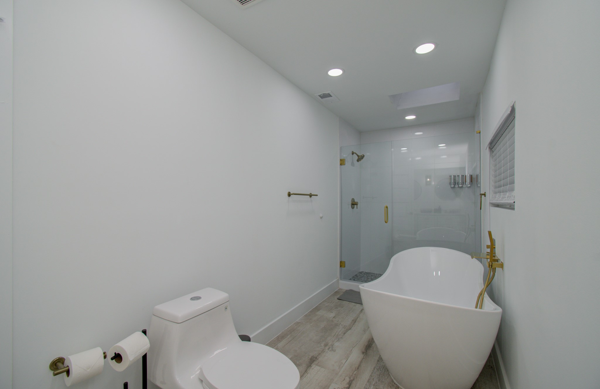 5539 Edith Street Houston, TX 77081 - Photo 19 of 50 a bathroom with a toilet and a shower