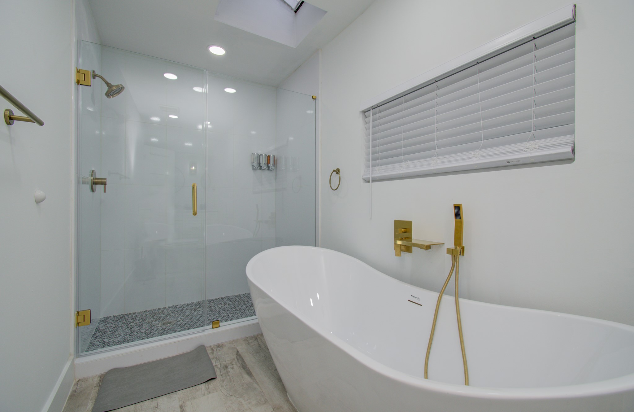 5539 Edith Street Houston, TX 77081 - Photo 20 of 50 a bathroom with a bathtub and shower