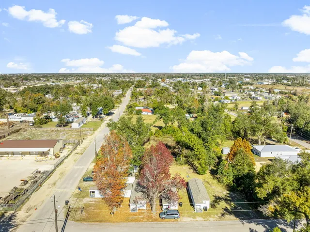 an aerial view of residential building and ocean view