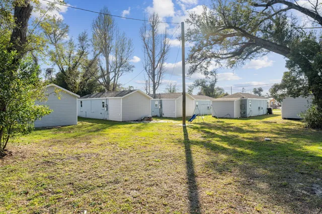 a view of a house with basketball court