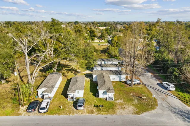 an aerial view of residential building with parking space