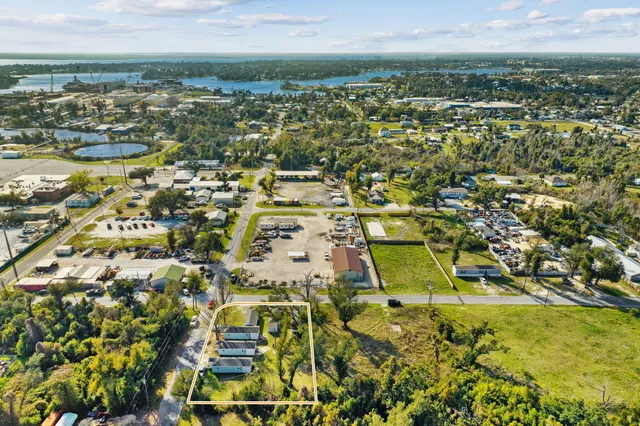 a view of a entryway with furniture and wooden floor