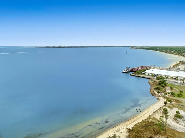 an aerial view of a house with a swimming pool yard and outdoor seating