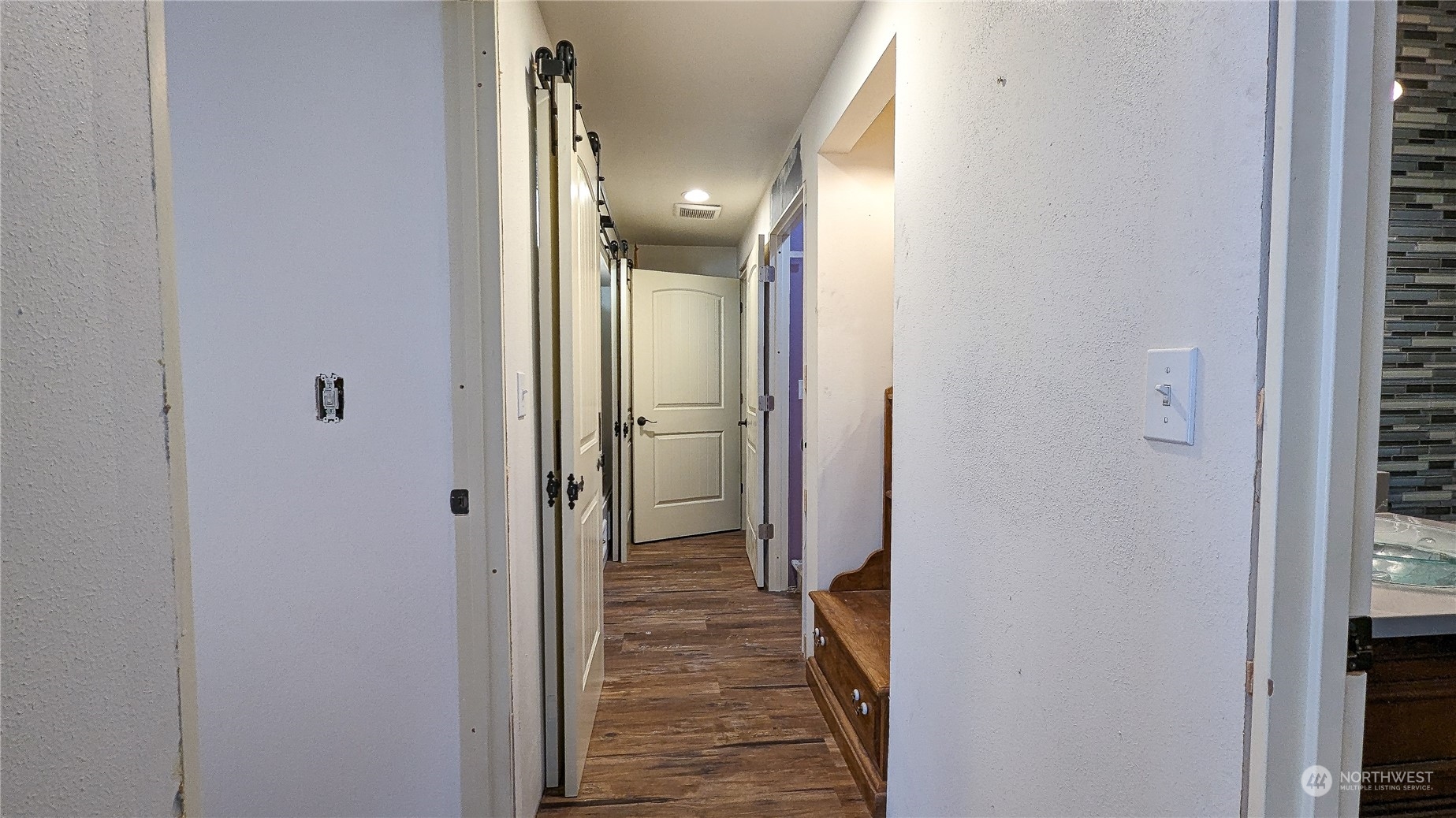 740 Cape Labelle Road Tonasket, WA 98855 - Photo 12 of 40 a view of a hallway with a hallway