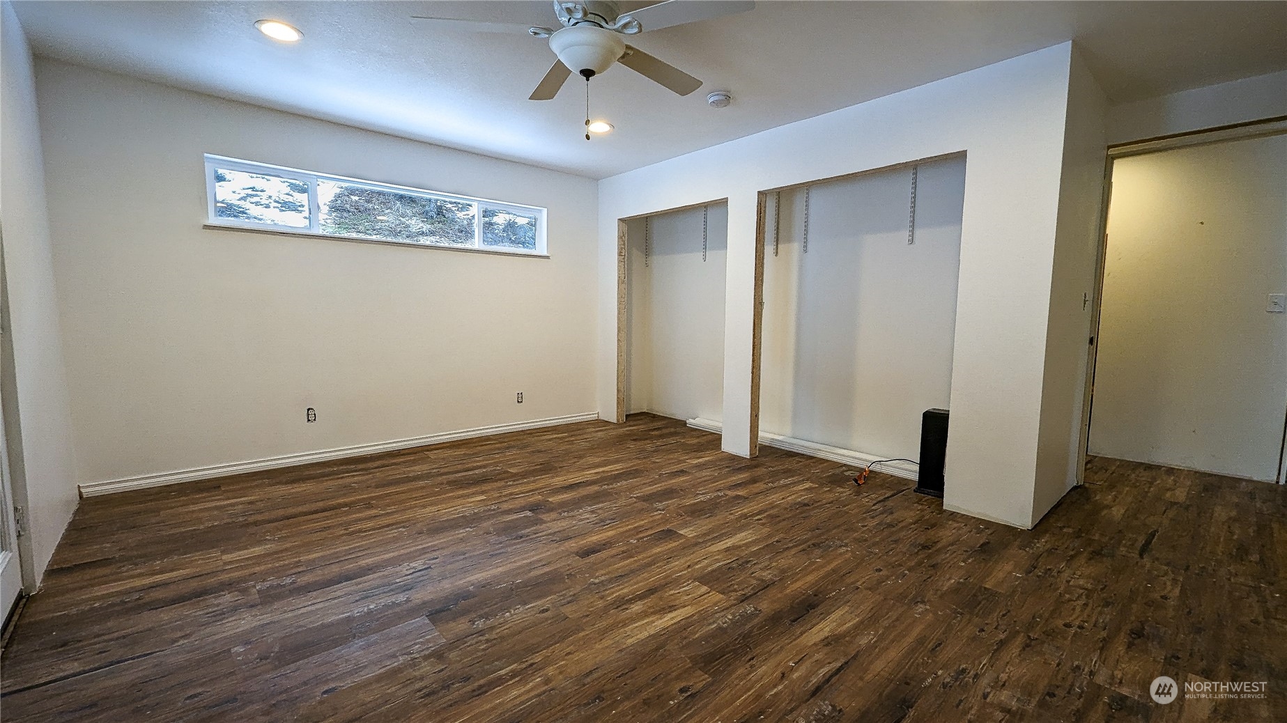 740 Cape Labelle Road Tonasket, WA 98855 - Photo 15 of 40 a view of empty room with wooden floor