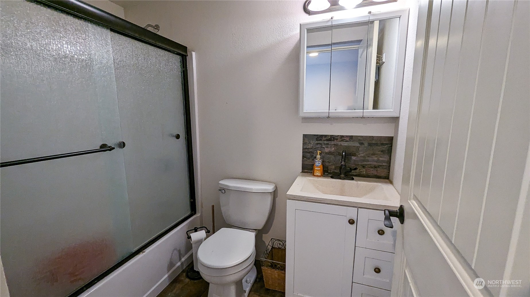 740 Cape Labelle Road Tonasket, WA 98855 - Photo 20 of 40 a bathroom with a toilet sink and mirror