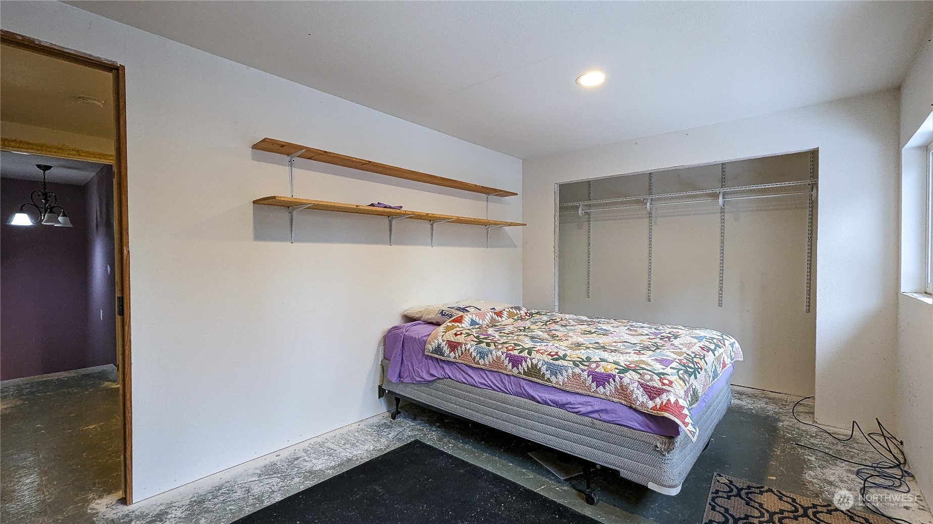 740 Cape Labelle Road Tonasket, WA 98855 - Photo 22 of 40 a bedroom with a bed and a window