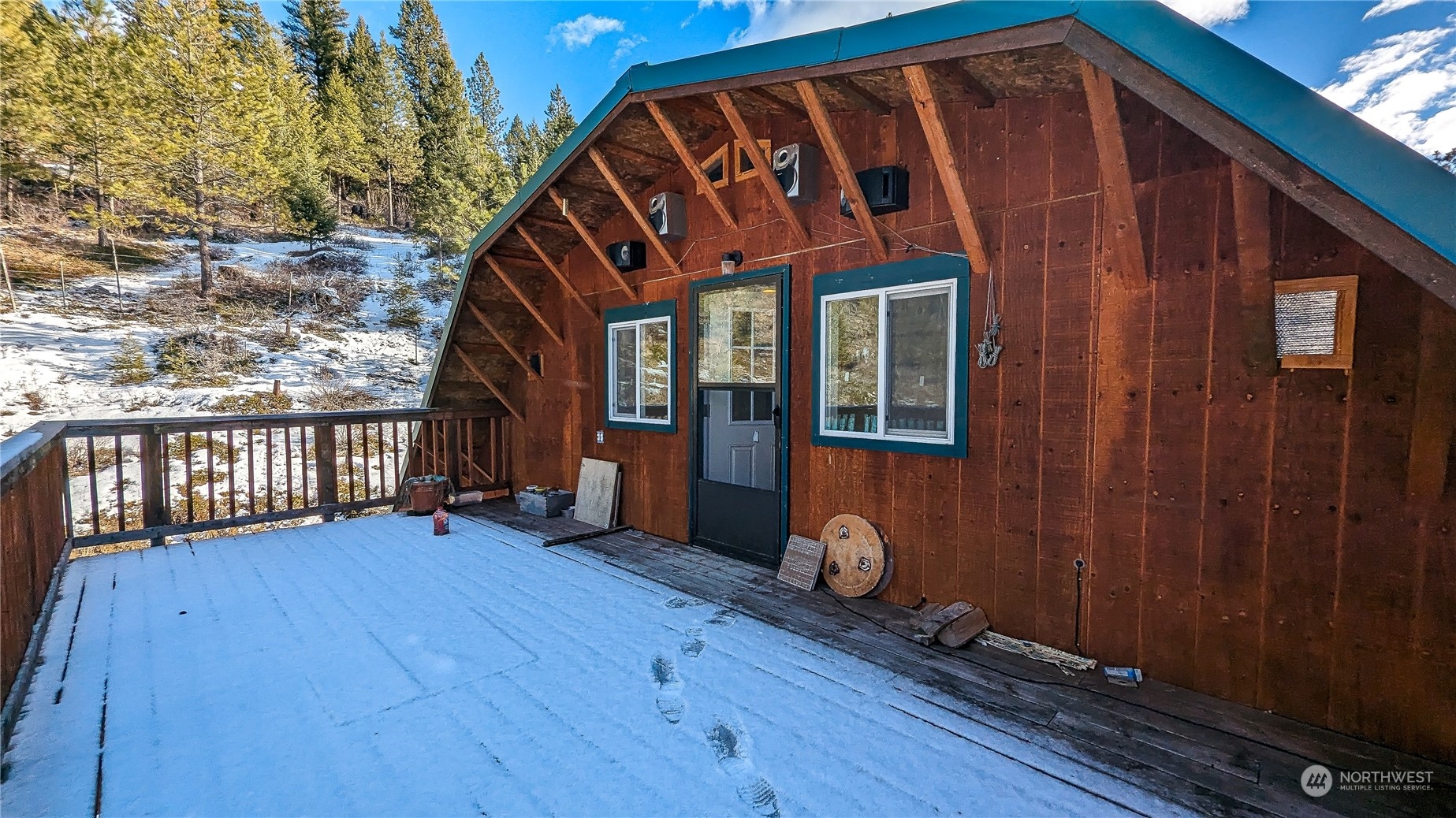 740 Cape Labelle Road Tonasket, WA 98855 - Photo 24 of 40 a view of wooden house with a large window