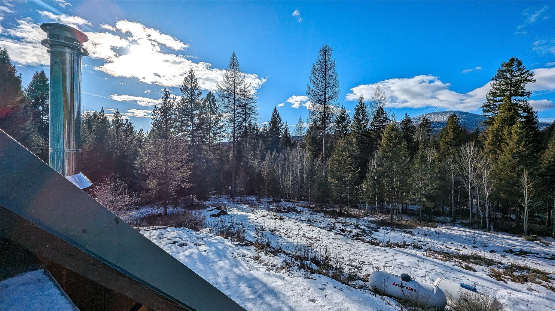 740 Cape Labelle Road Tonasket, WA 98855 - Photo 26 of 40 a view of a backyard of a house