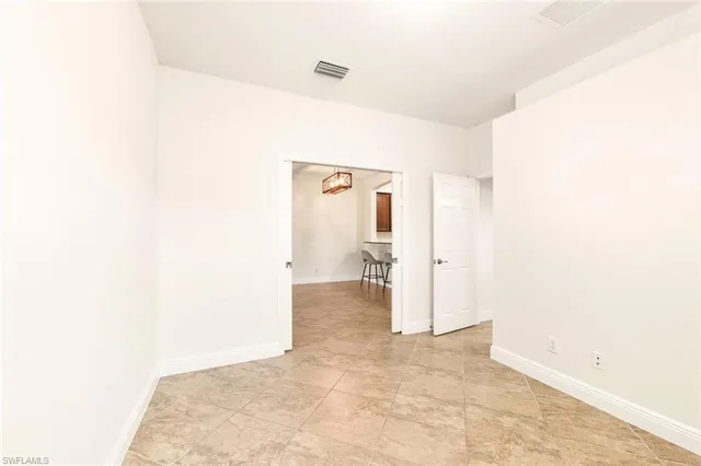 a view of a room with a hallway