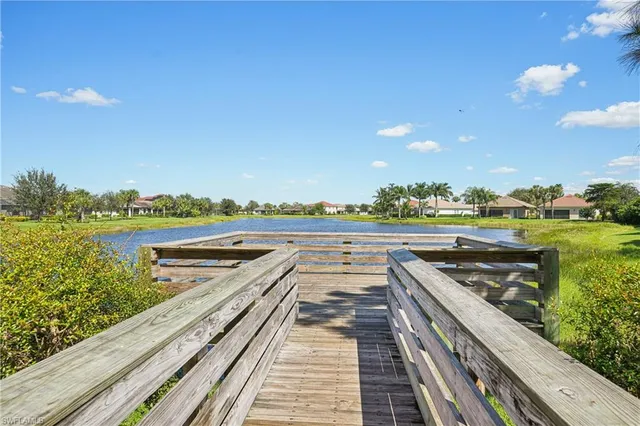 a view of a balcony with wooden floor and outdoor space