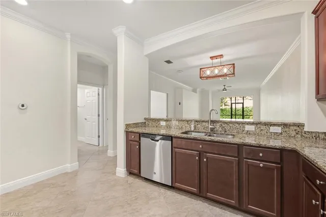 a bathroom with a granite countertop double vanity sink and a mirror