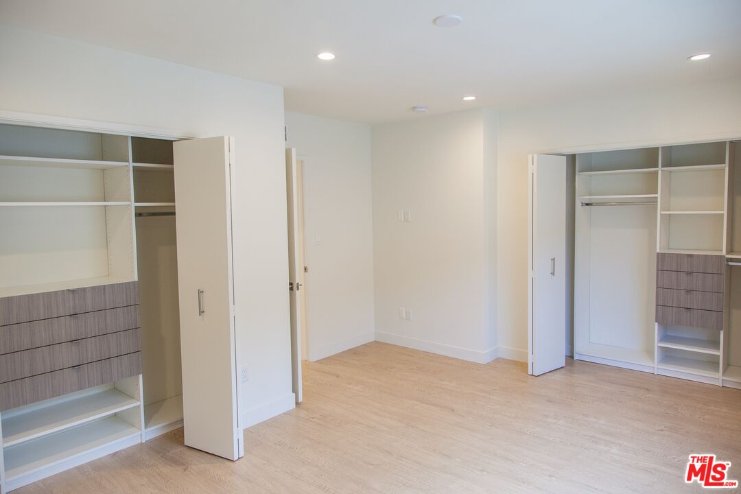 508 North Kings Road, Unit 2 West Hollywood, CA 90048 - Photo 7 of 15 an empty room with shelves