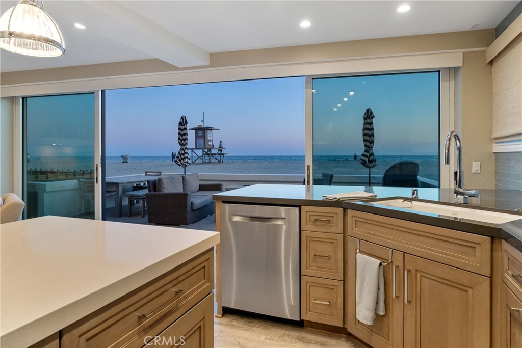 4403 Seashore Drive Newport Beach, CA 92663 - Photo 15 of 69 a kitchen with sink and refrigerator