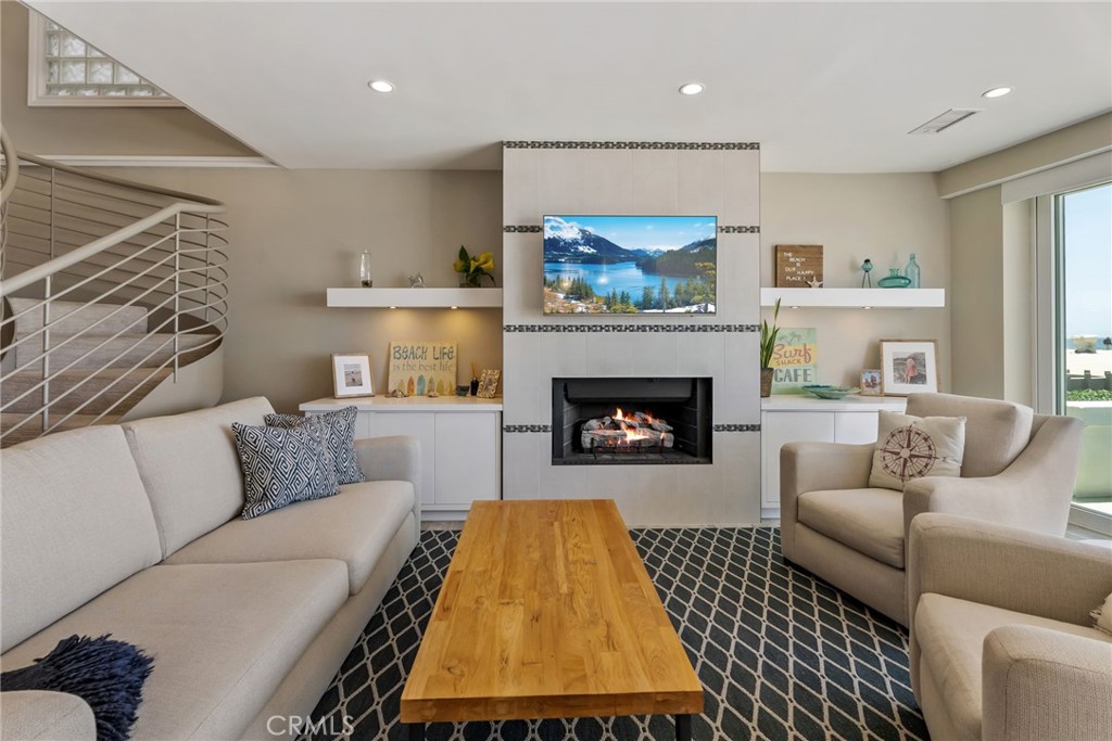 4403 Seashore Drive Newport Beach, CA 92663 - Photo 16 of 69 a living room with furniture and a fireplace