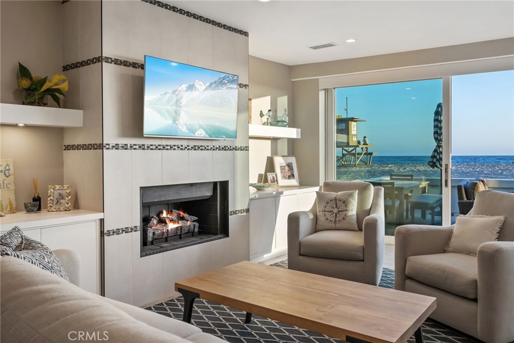 4403 Seashore Drive Newport Beach, CA 92663 - Photo 17 of 69 a living room with furniture and a fireplace
