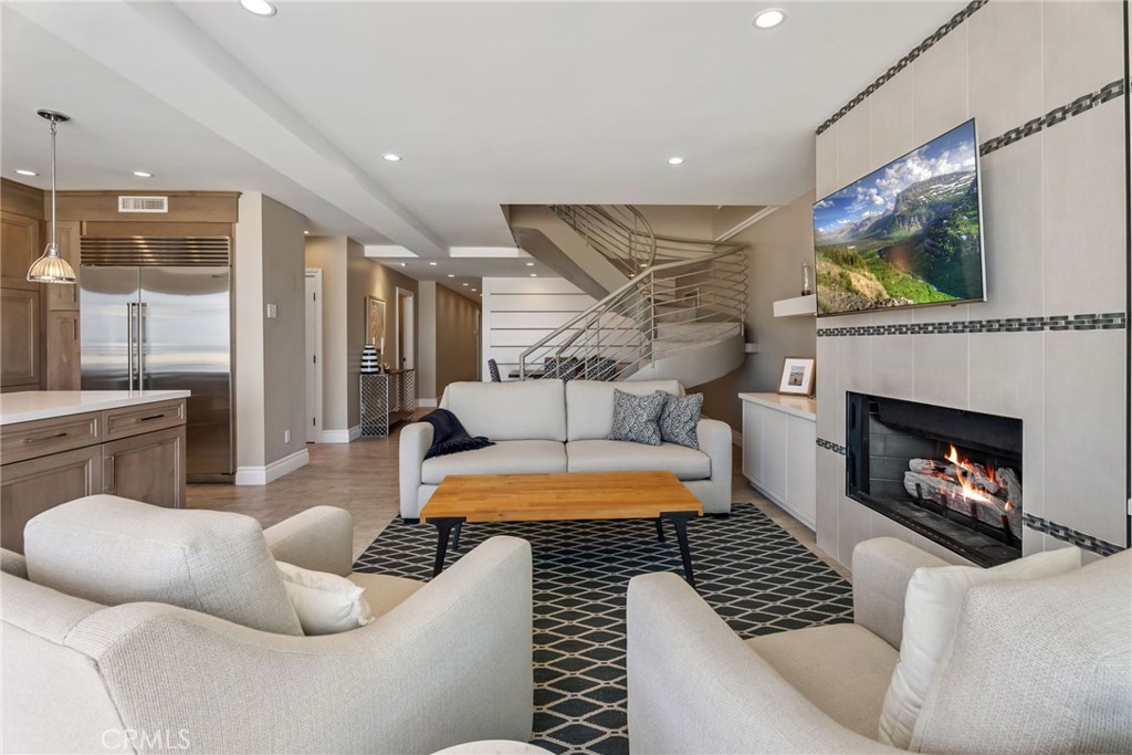 4403 Seashore Drive Newport Beach, CA 92663 - Photo 20 of 69 a living room with furniture and a fireplace