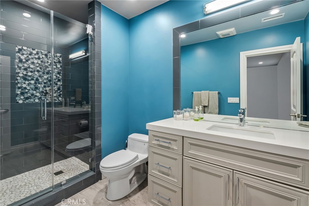 4403 Seashore Drive Newport Beach, CA 92663 - Photo 24 of 69 a bathroom with a sink a toilet and shower