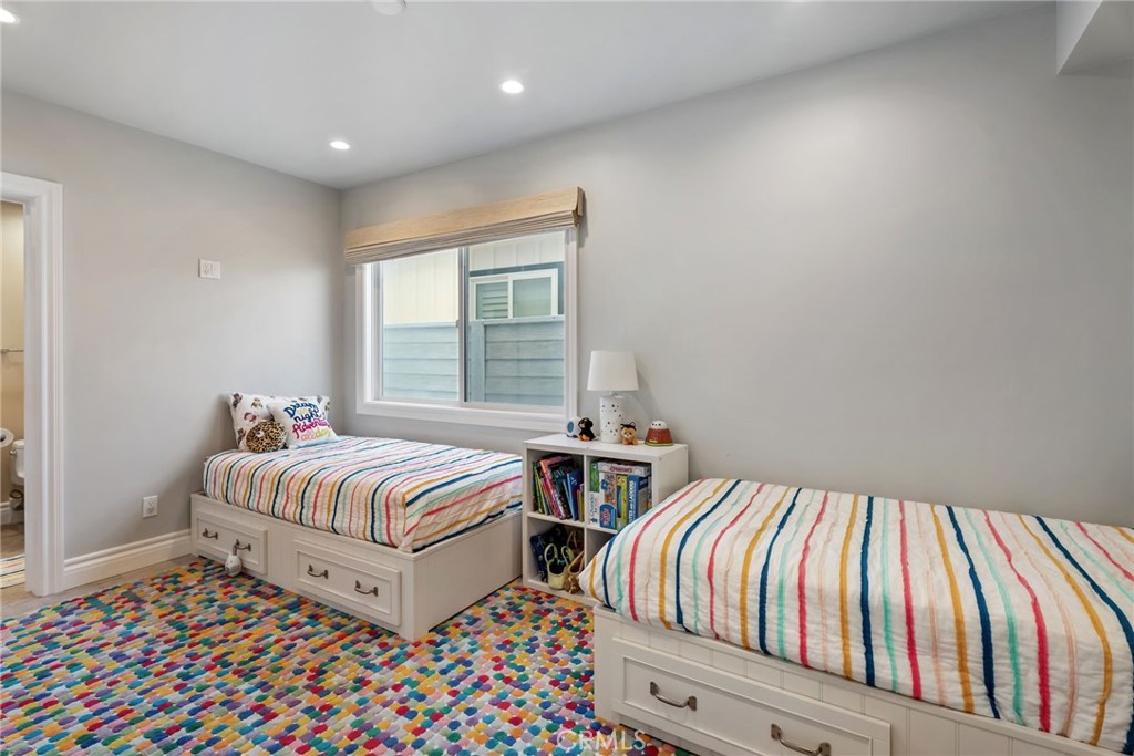 4403 Seashore Drive Newport Beach, CA 92663 - Photo 27 of 69 a bedroom with two beds and a window